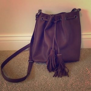 American Eagle over-the-shoulder tassel purse